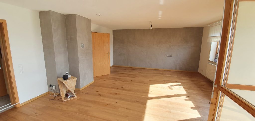 Gestaltung mit Basebeton in einem Wohnzimmer vom Maler